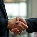 A friendly handshake signaling a completed job